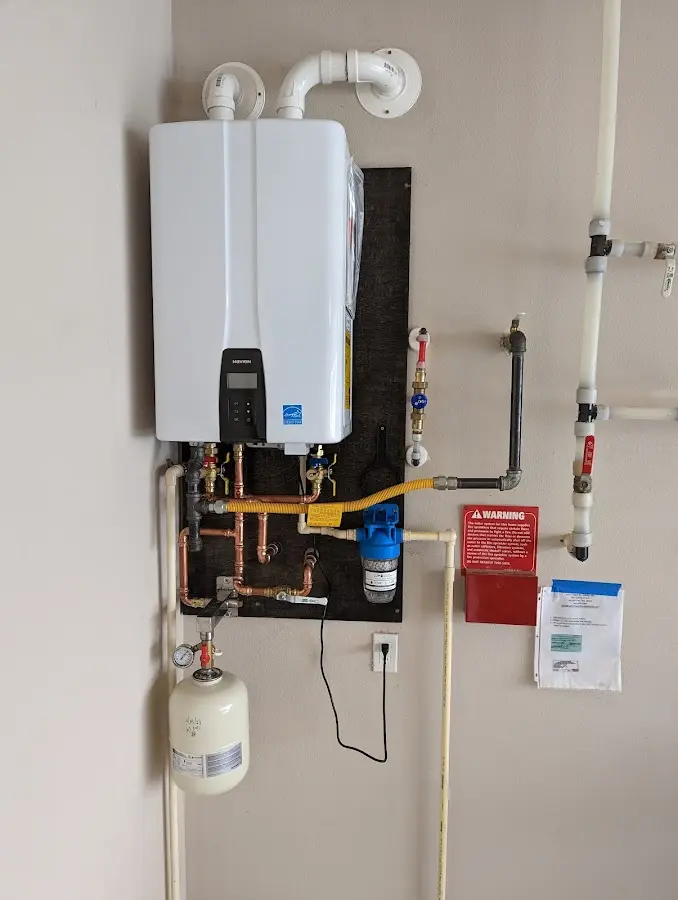 Professional plumber installing copper piping in a Jacksonville home